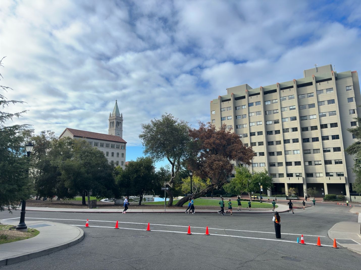 A group of people running in a streetAI-generated content may be incorrect.